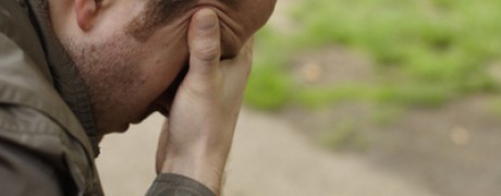 photo of a worried man with his head in his hand - how to handle a relapse