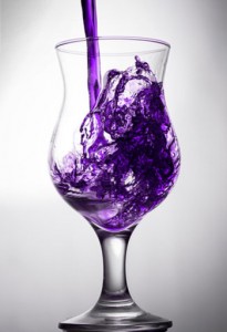 photo of a clear glass with purple liquid being poured into it - sizzurp - freedom interventions