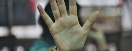 photo of the palm of a hand pushing away with head turned - when they say no - freedom interventions