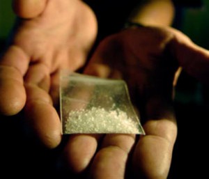 photo of hands holding a bag of methamphetamine - Freedom Interventions